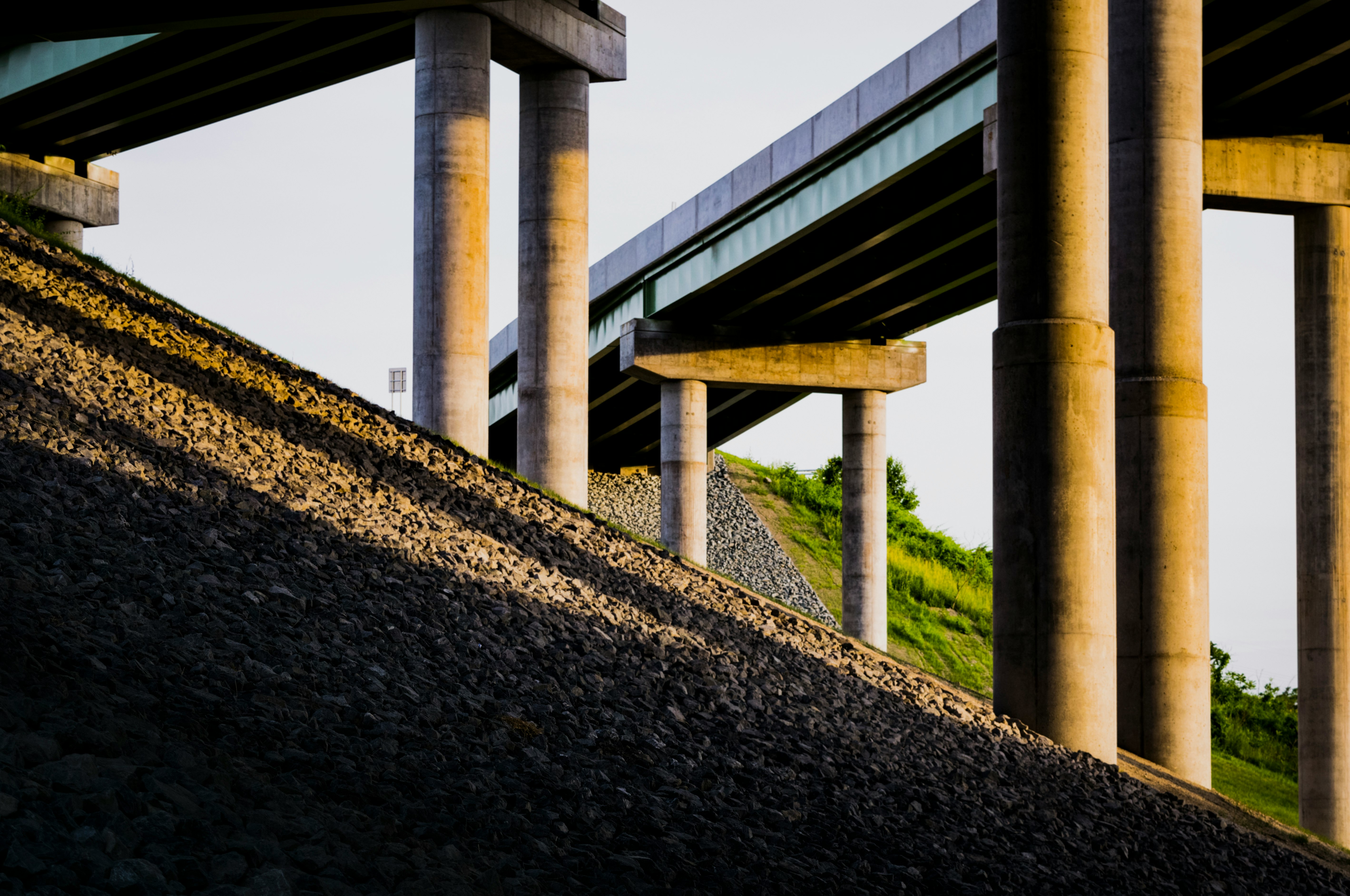 low-angle photography of concrete bridge